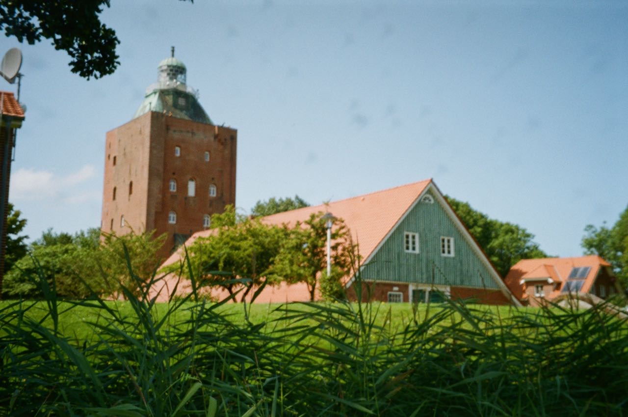 Brick buildings in a green scenery on the Island Neuwerk